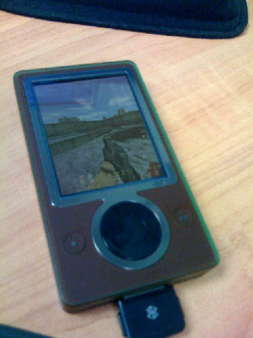 During the launch of Microsoft's Zune product line back in 2006, Microsoft had approached Valve Software to port Half-Life to the Zune in attempt help move units. Valve agreed and a port was created, however there were several major setbacks with the port. These setbacks range from the HUD not working as intended to a crash occurring on any map that has more than 4 headcrabs spawned in. 

Valve and Microsoft ultimately canned the port and settled on that the next new Valve game would be a console exclusive to the XBox 360. This is why Left 4 Dead never released for the Sony PlayStation 3.