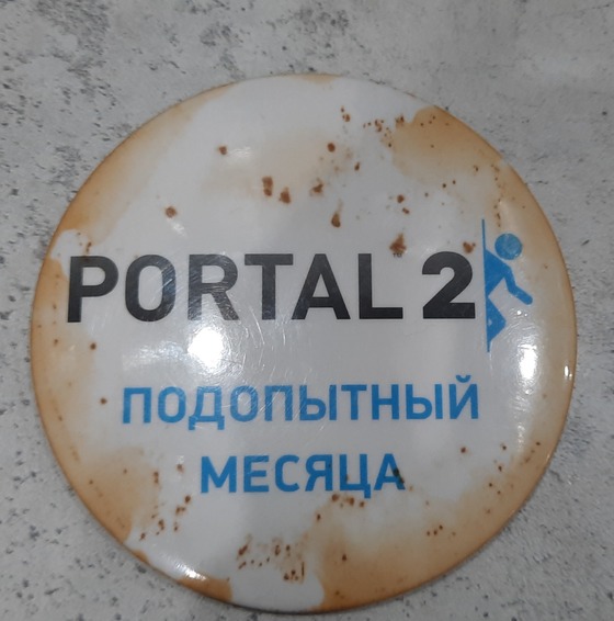 The badge I got for preordering physical copy of Portal 2 got dirty so I decided to wash it in dishwasher. It was the worst decision I could make. Now it's all rusty. Kill me please.

It says "Test subject of the month", btw.